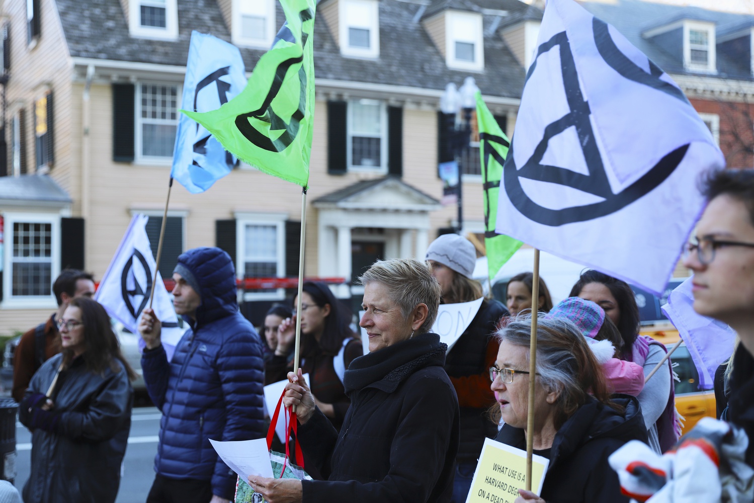A crowd of protesters converged on Friday to urge Harvard to divulge its investments.