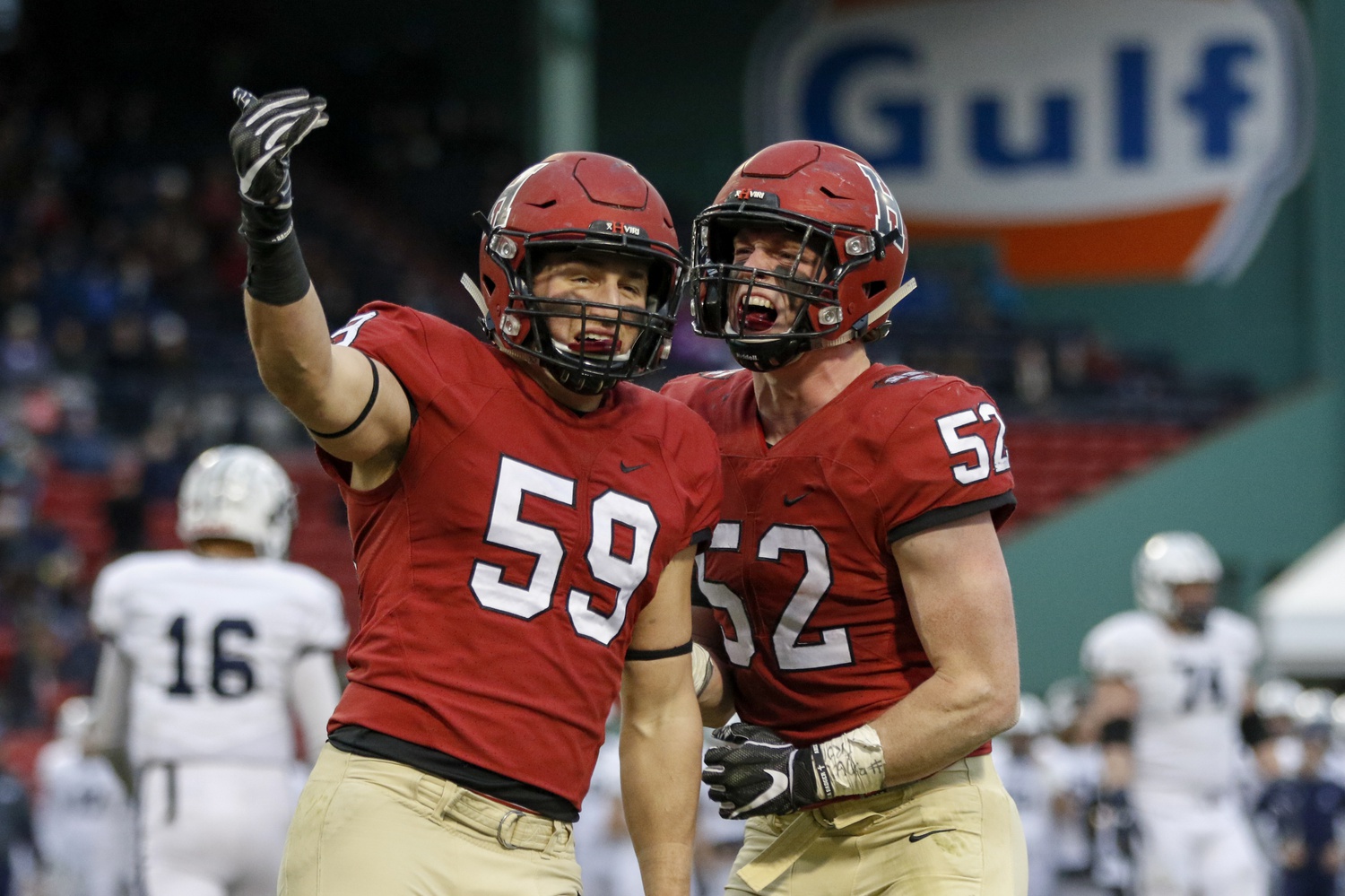 Linebackers Derek "Cameron" Kline '20 and Joseph L. Goodman '20 celebrate a stop during last year's Harvard win in the 135th playing of The Game against Yale. Kline, Goodman, and the rest of the Crimson defense will be tested by Yale's effective passing game in this Saturday's playing of The Game in New Haven.