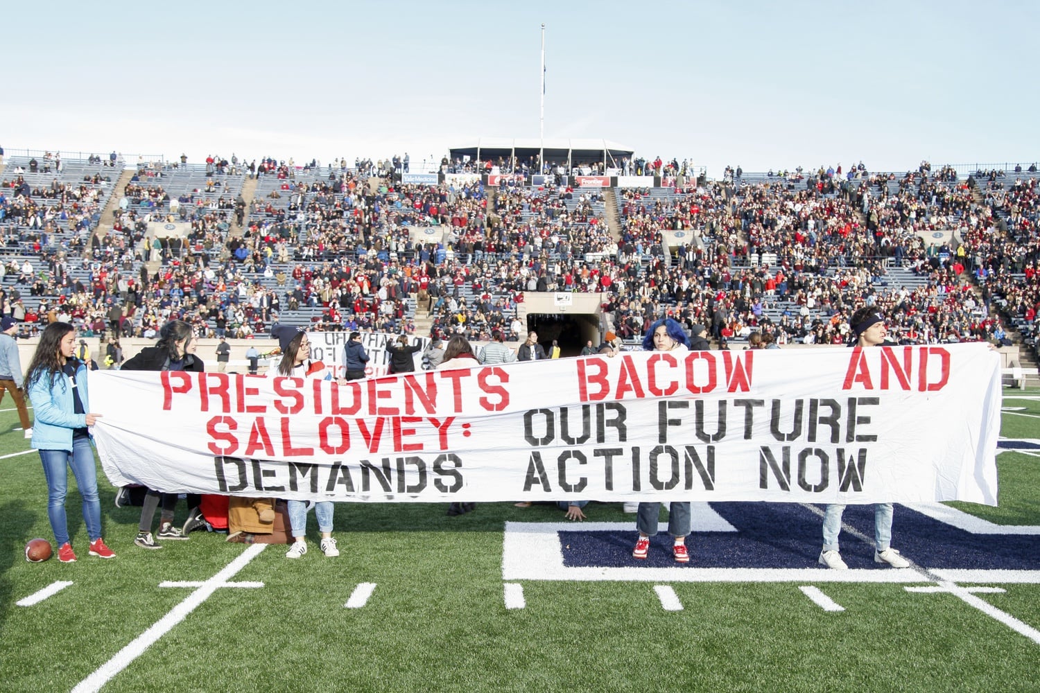 Students at Harvard and several other Ivy League institutions have long pushed for their universities divest from fossil fuels — including through a protest on the field of the Yale Bowl during halftime of the 136th edition of the Game.