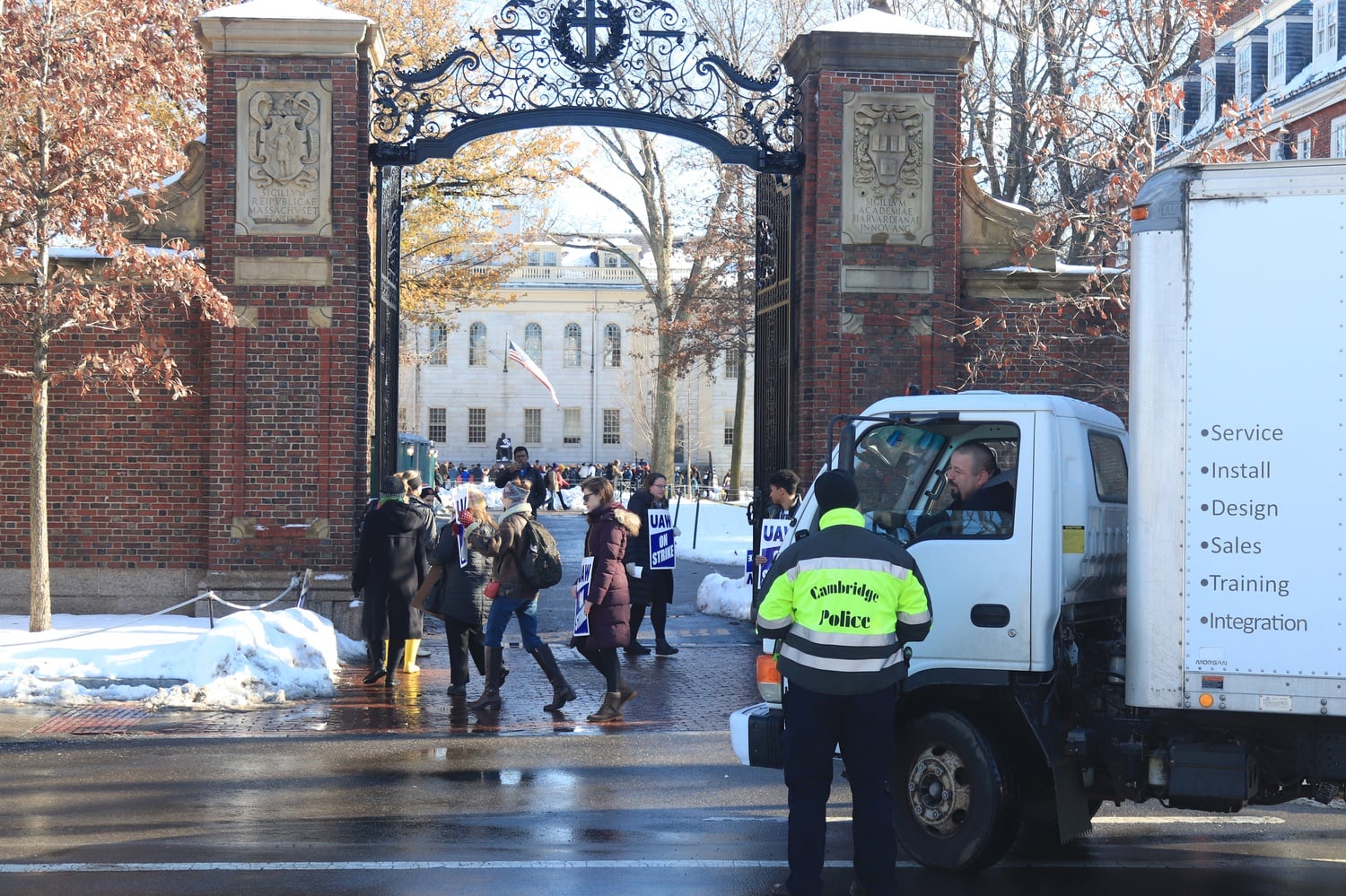 Picketers blocked delivery and mail trucks from entering Johnston Gate of Harvard Yard.