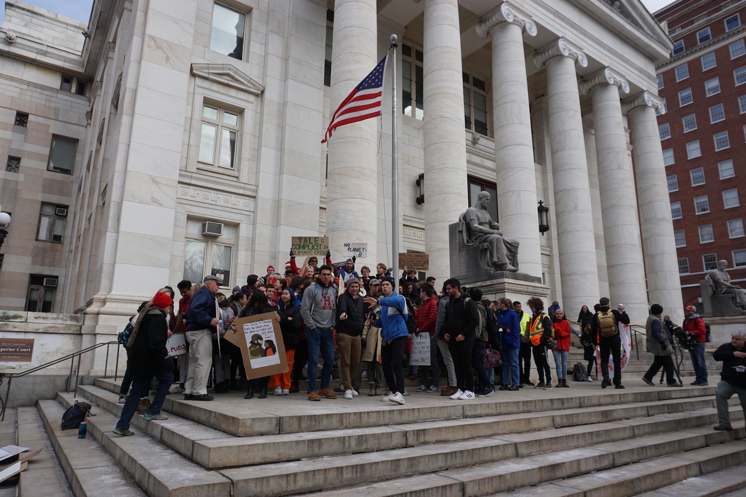 More than 50 Yale and Harvard students gathered outside of New Haven Superior Court Friday morning after several students appeared for a hearing after their November arrest for demonstrating at the Harvard-Yale football game.