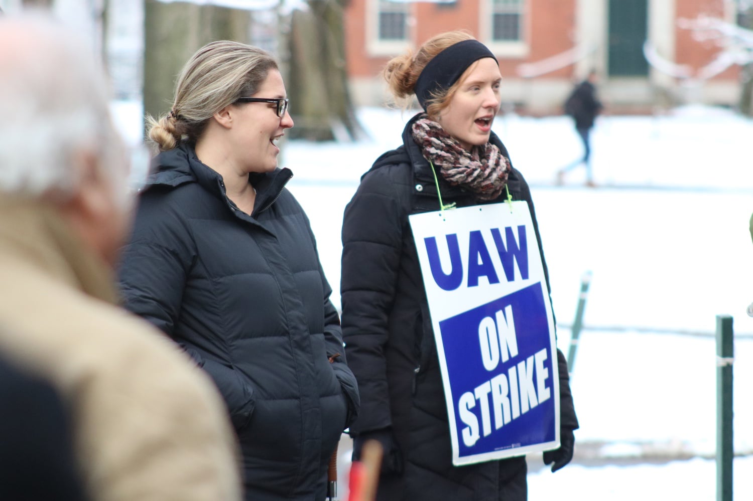 Members of the Harvard Graduate Student Union-United Automobile Workers stand in front of University Hall. The union has reached their seventh day of picketing with negotiations still ongoing.