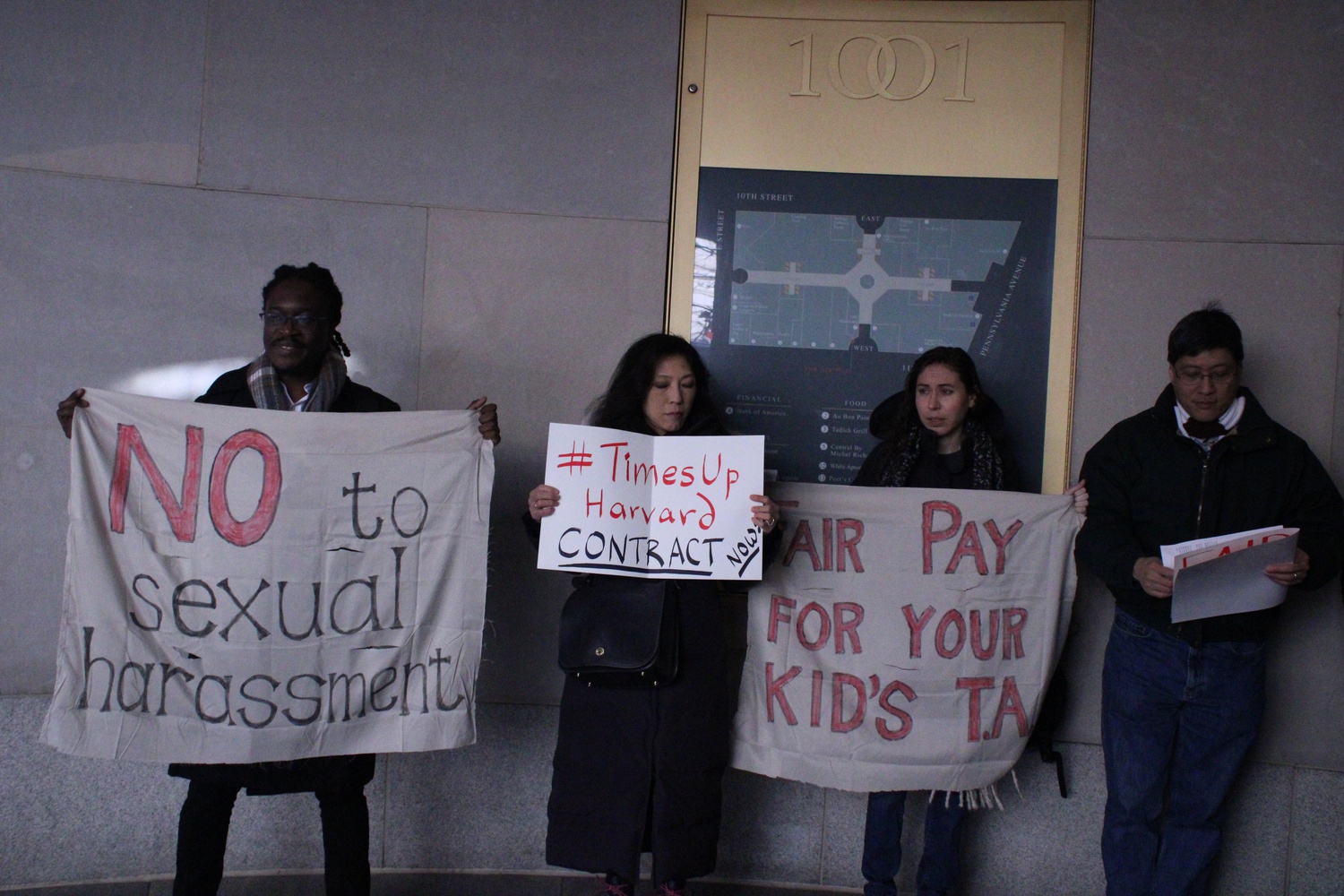 Supporters of Harvard Graduate Students Union-United Automobile Workers protested at the Washington, D.C. office of Harvard Corporation member David M. Rubenstein Wednesday.