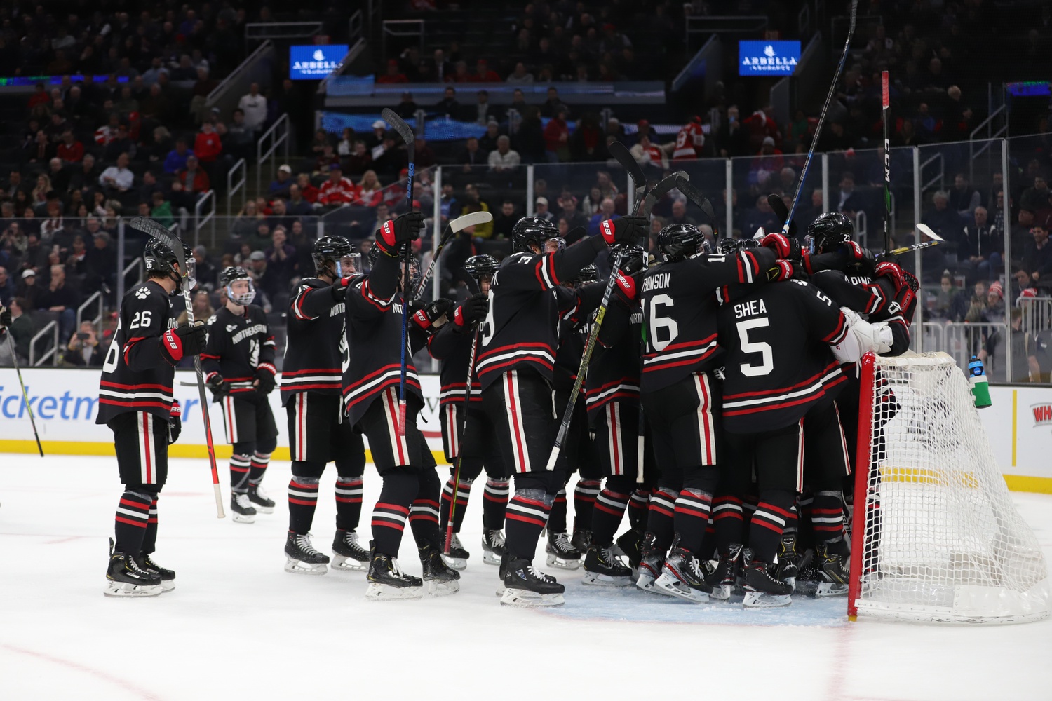 Northeastern celebrates the 3-1 victory after icing the game with a long-range empty netter in the final minute.