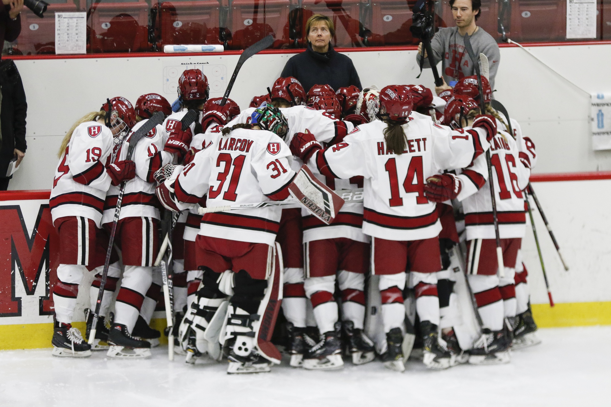 Harvard huddles during its 2019 Beanpot finals appearance against Boston University. This year, however, the Crimson will not have the chance to avenge its overtime loss to the Terriers, falling in the 2020 semifinals.