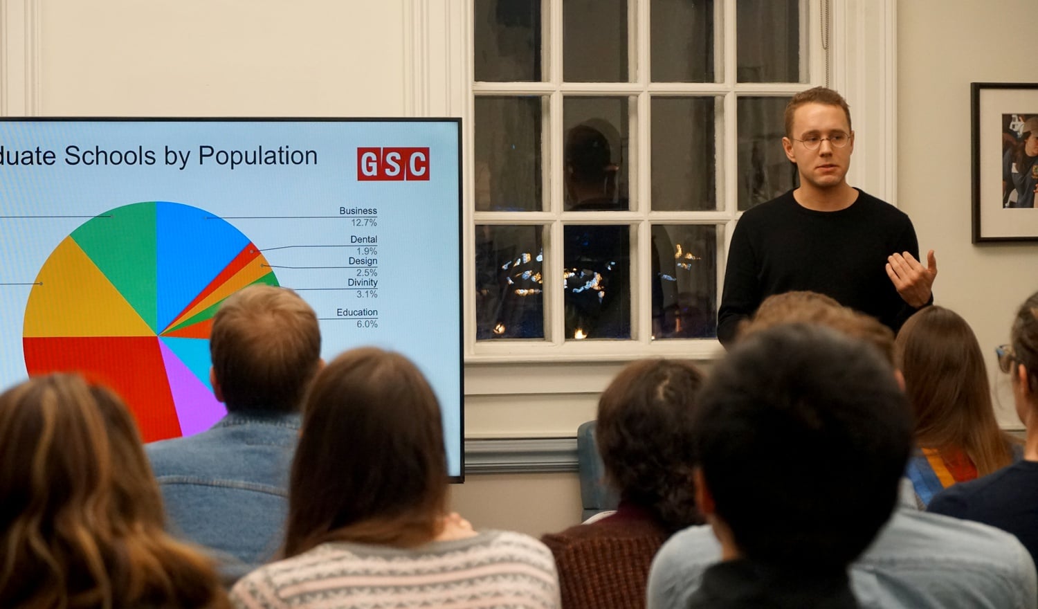 Zachary M. Hayworth, president of the Graduate Student Council, opens the body's monthly meeting on February 5.