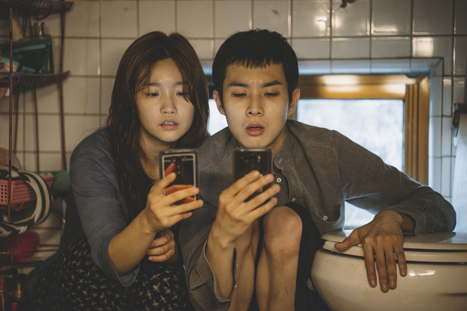 So-dam Park (left) stars as Ki-jung Kim and Woo-sik Choi (right) stars as Ki-woo Park in "Parasite" (2019), directed by Bong Joon-ho.