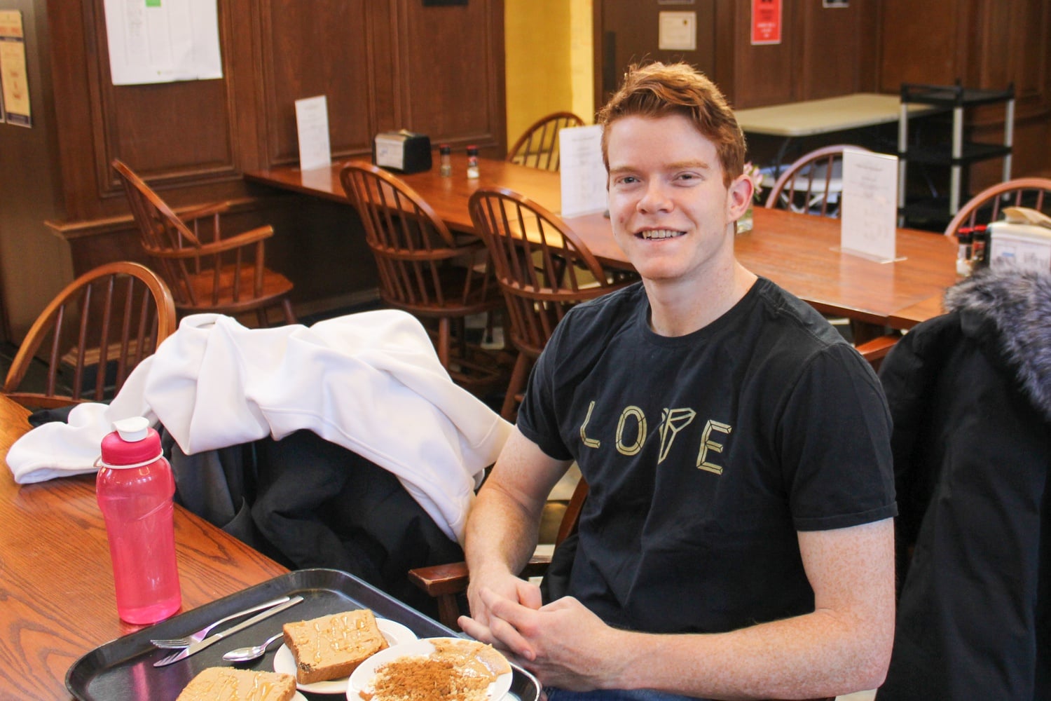Co-President of the Student Athletic Advisory Committee Matthew Thomas '21 is involved with the search for Harvard's new Athletic Director, in the Winthrop dining hall early Saturday morning.