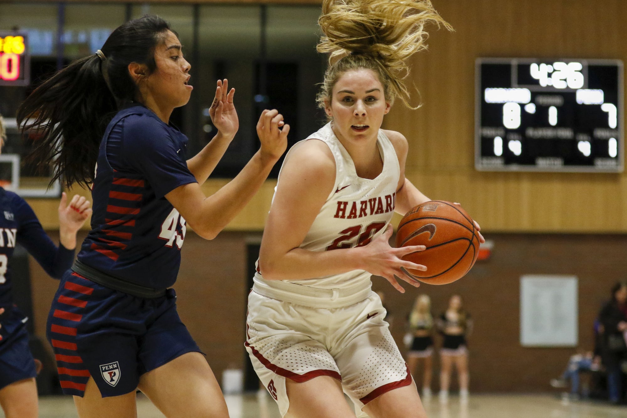 Lola Mullaney looks to drive in Harvard's big win over Penn earlier this season. She closed the season strong, scoring 33 points in the Crimson's final two games.