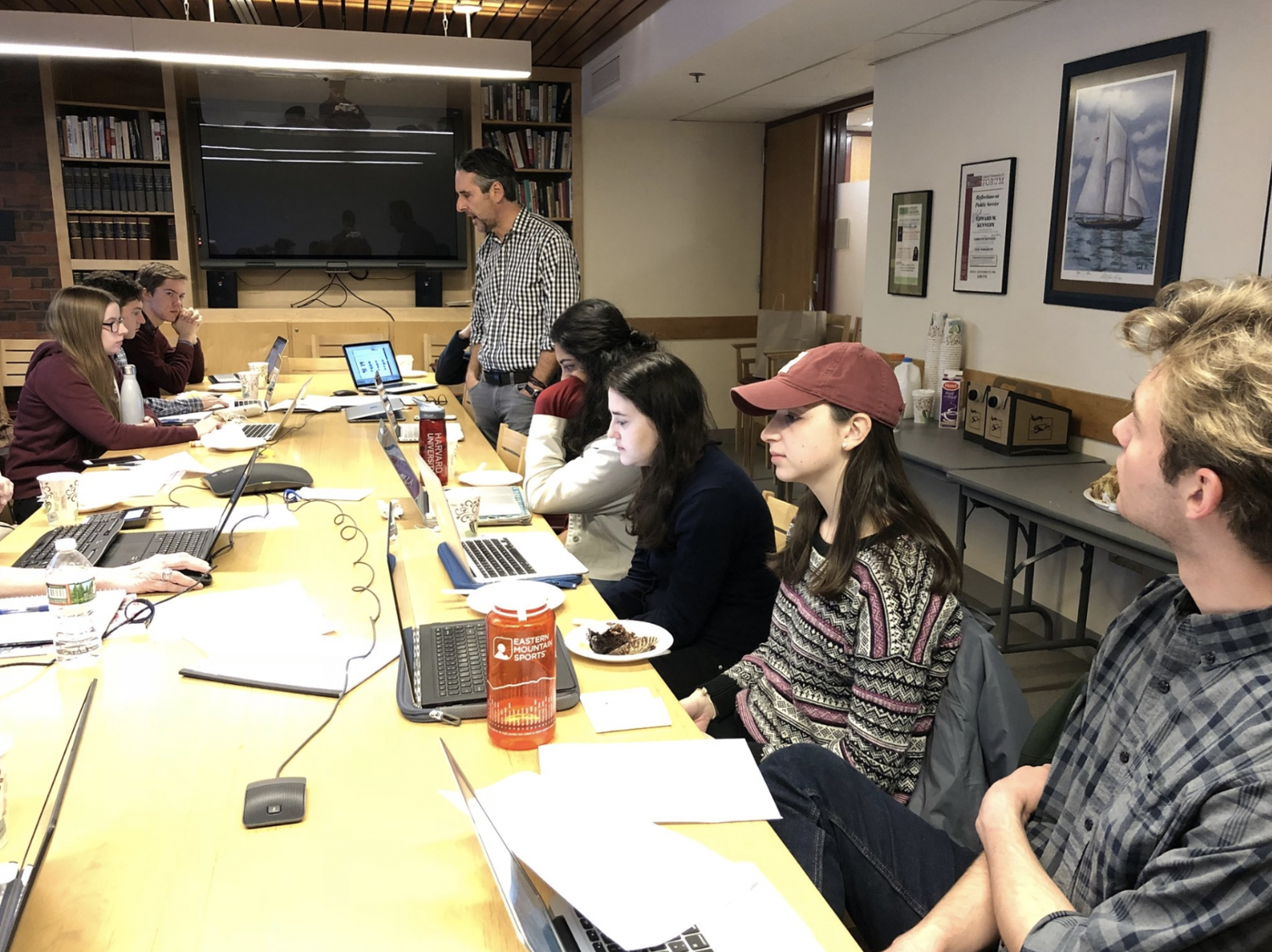 John Della Volpe is briefing Parkland students over breakfast about HPOP findings with other members of the student committee.