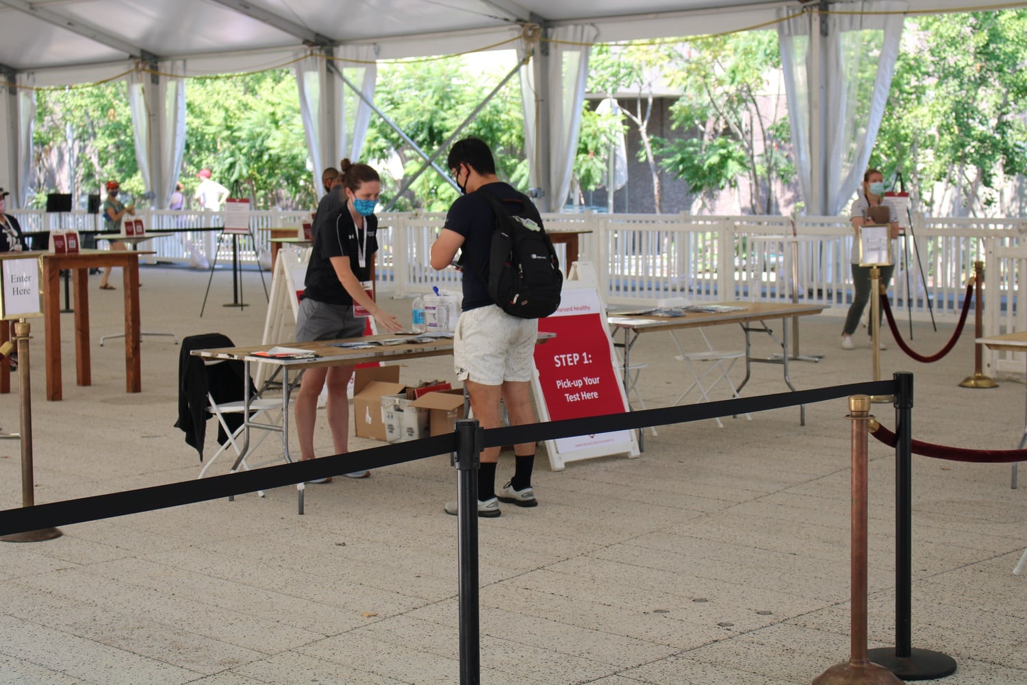 A student picks up a COVID-19 test in the Science Center tent during fall move-in last August.