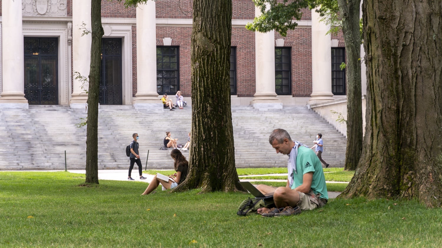 Tourists enjoy a socially-distant afternoon in the Yard.