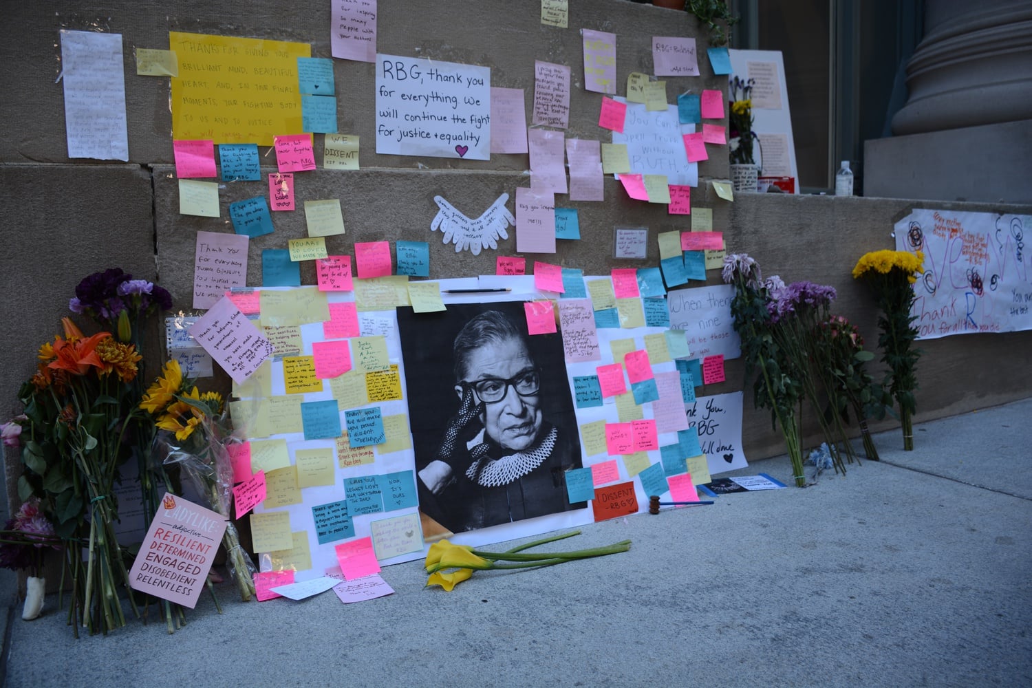 A memorial to Supreme Court Justice Ruth Bader Ginsburg, a Harvard Law School alumna, sprung up at the Law School this week after Ginsburg's death at the age of 87 Friday.