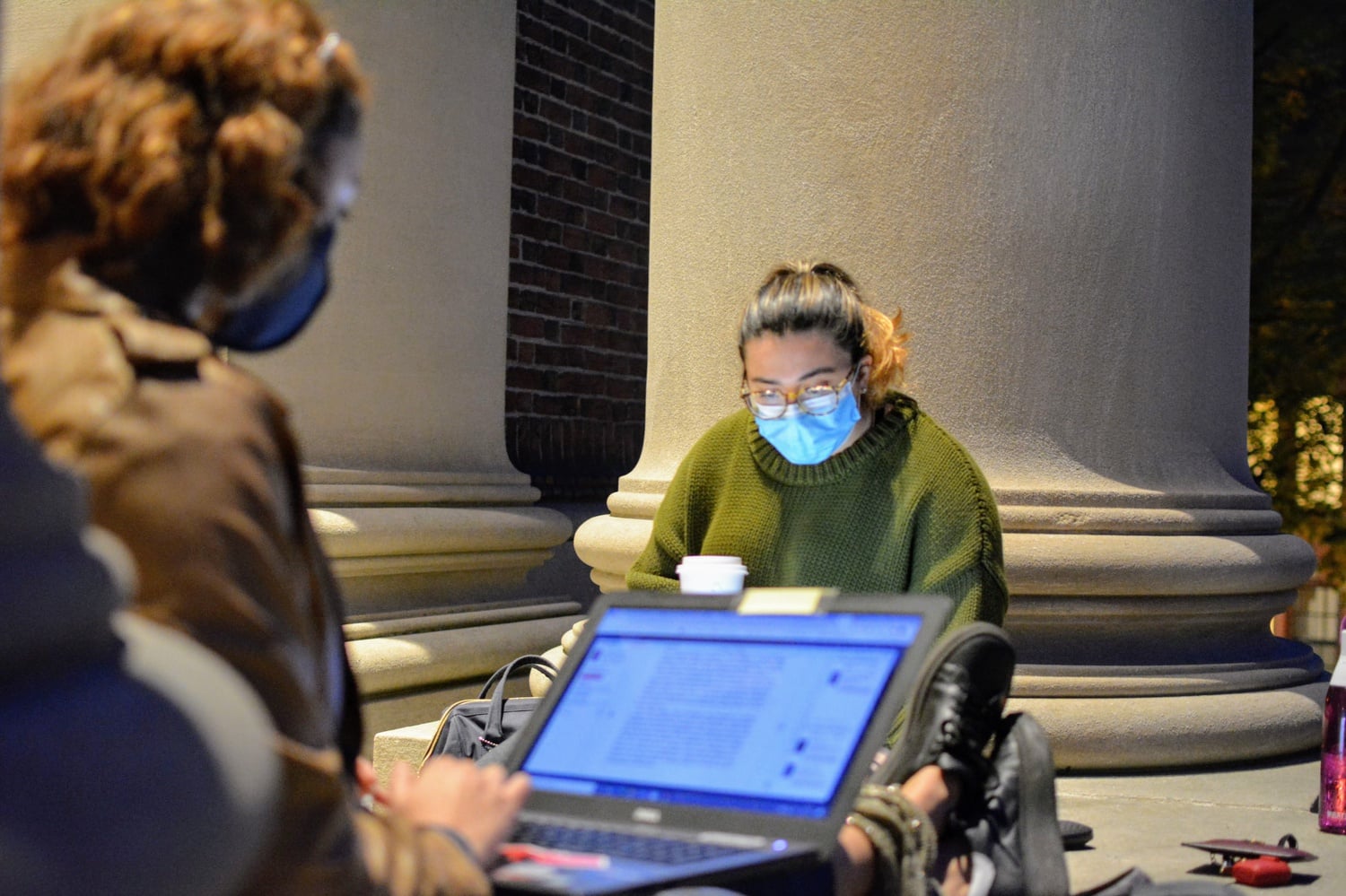 Debbie Perez ‘24 and Tatiana Miranda ‘24 sit on the steps of Widener Library to study during midterm week. Many facilities such as Widener library are closed to student entry at the moment; however, other study spaces such as the Smith Center have slowly begun to open.