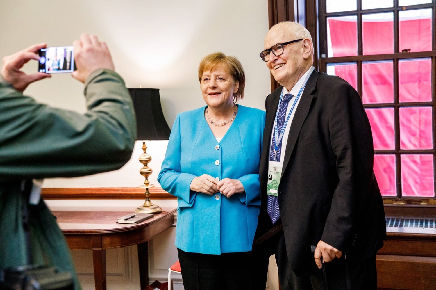 Guido Goldman and German Chancellor Angela Merkel speak at a luncheon during Harvard's 2019 Commencement.