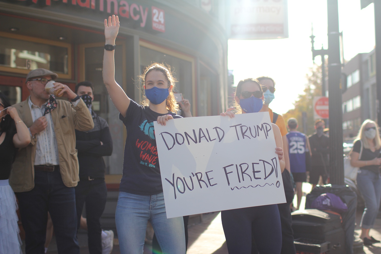 Masked revelers celebrate the victory of former Vice President Joseph R. Biden Jr. in Harvard Square.