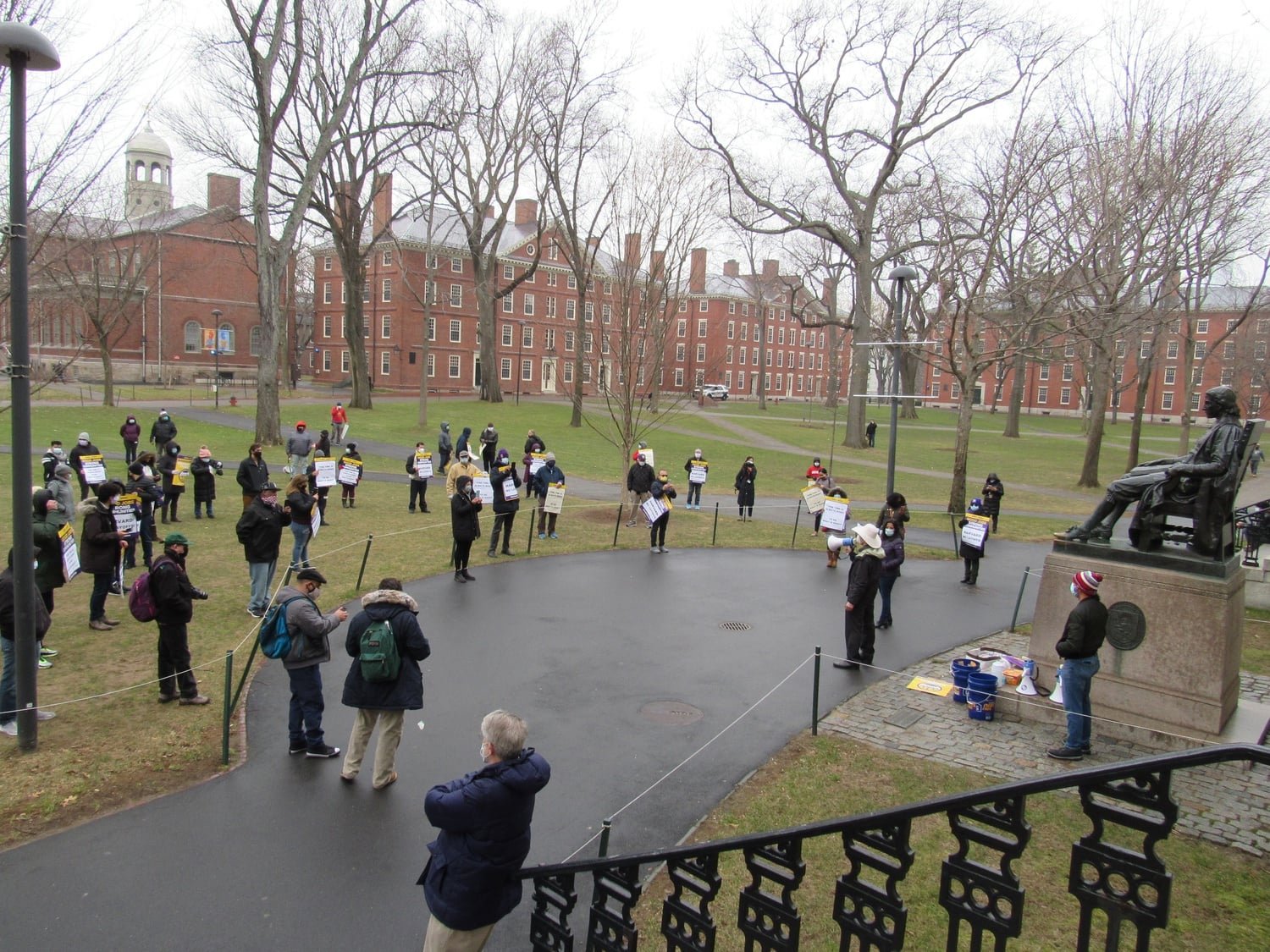 32BJ SEIU, the union representing custodians, and UNITE HERE Local 26, the union representing dining services staff, held a socially-distanced rally at Harvard Yard on Thursday, Jan. 14.