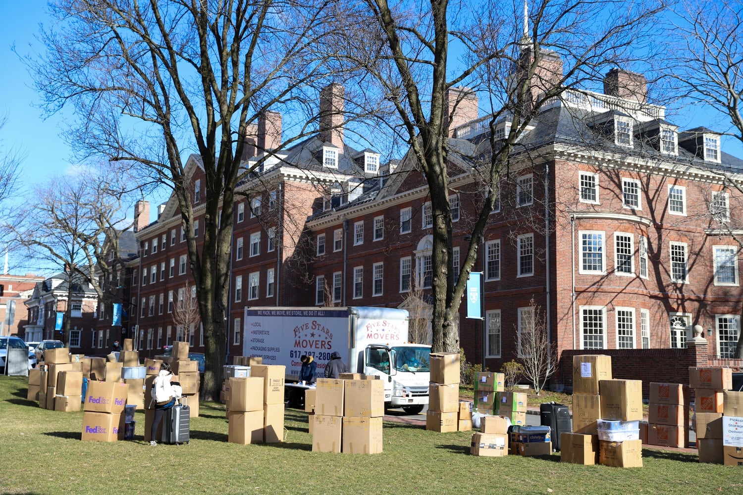 Students pick up boxes outside Lowell House on Saturday.