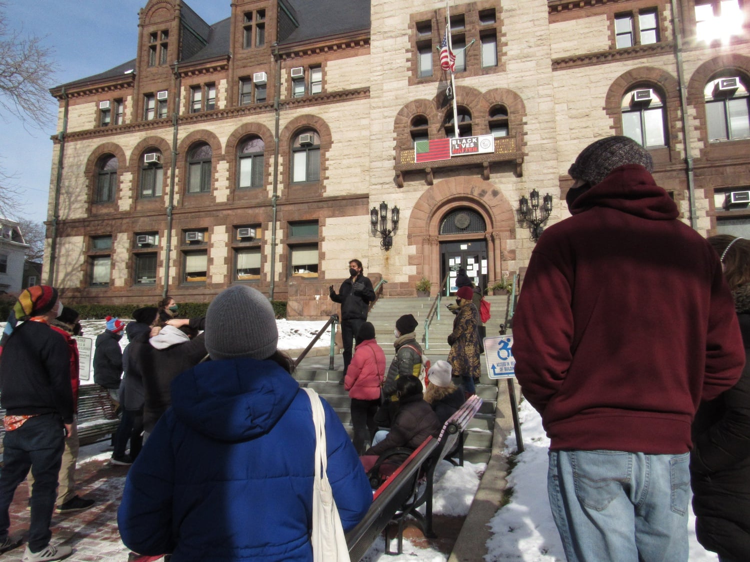 Cambridge City Councilor Jivan Sobrinho-Wheeler addresses Project Right to Housing advocates during a rally on the Cambridge City Hall steps on Sunday.