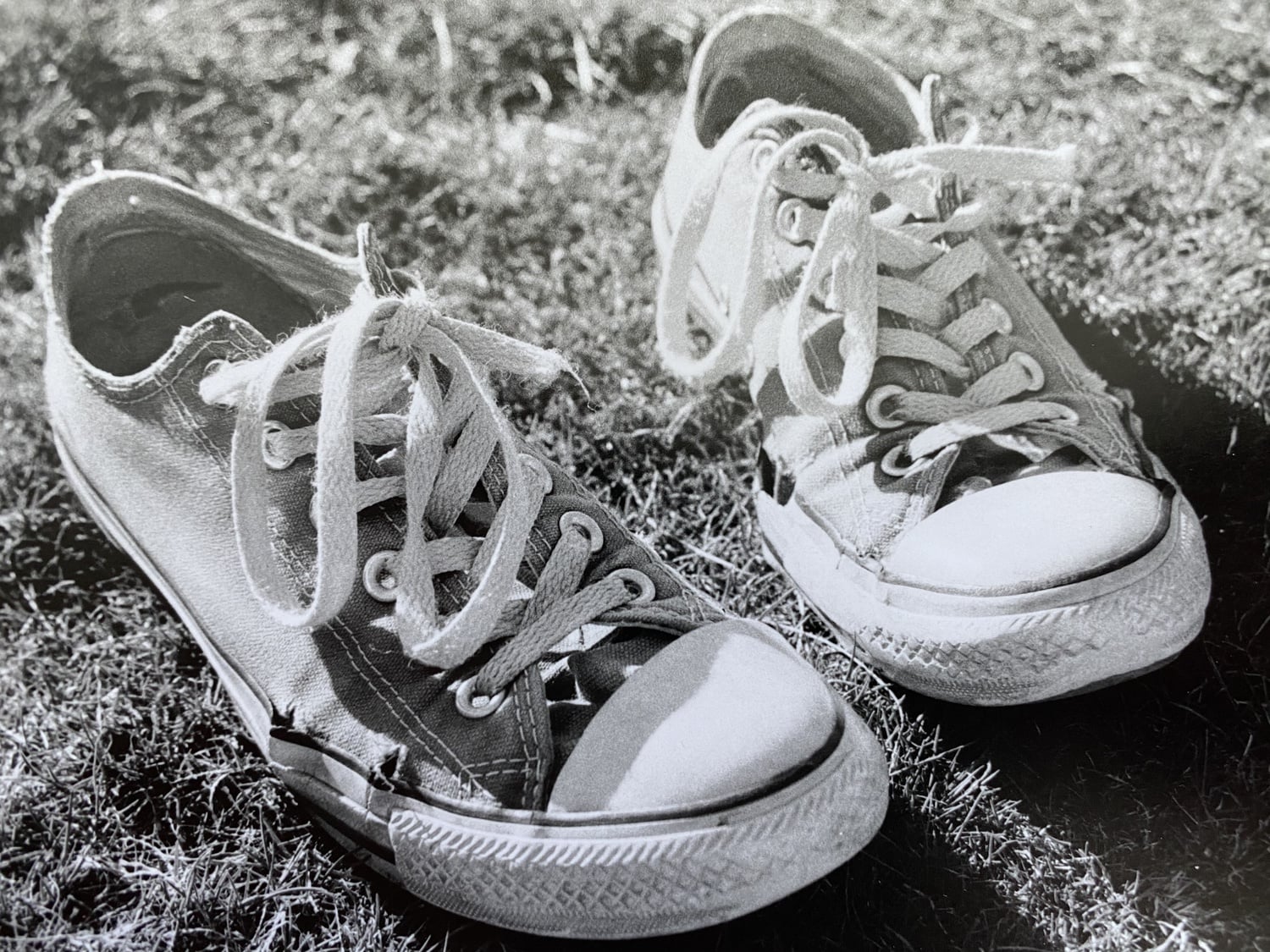 An abandoned pair of Converse sneakers