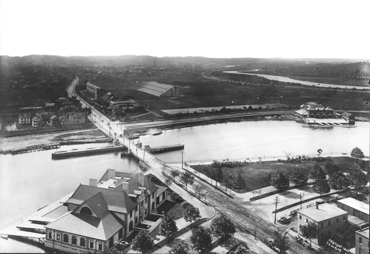 In 1907, Harvard’s new stadium shown here across the river was three years old