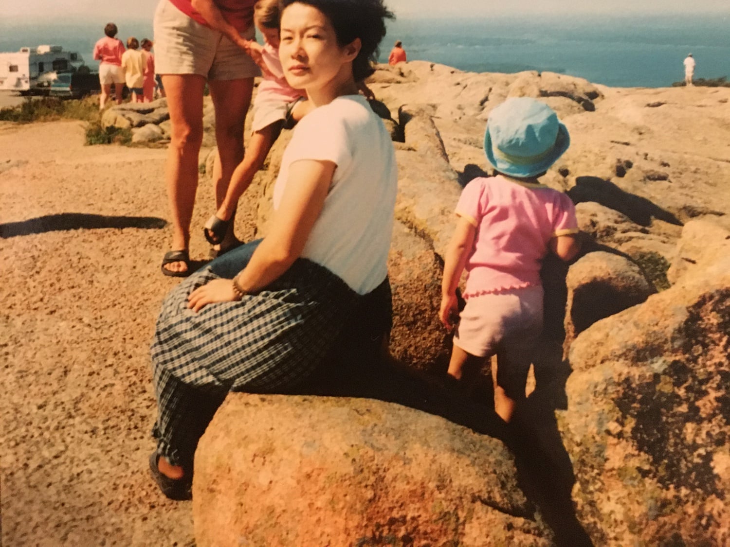 Isabella B. Cho ’24’s mother, still a graduate student, gazes at the camera during a road trip with family friends.