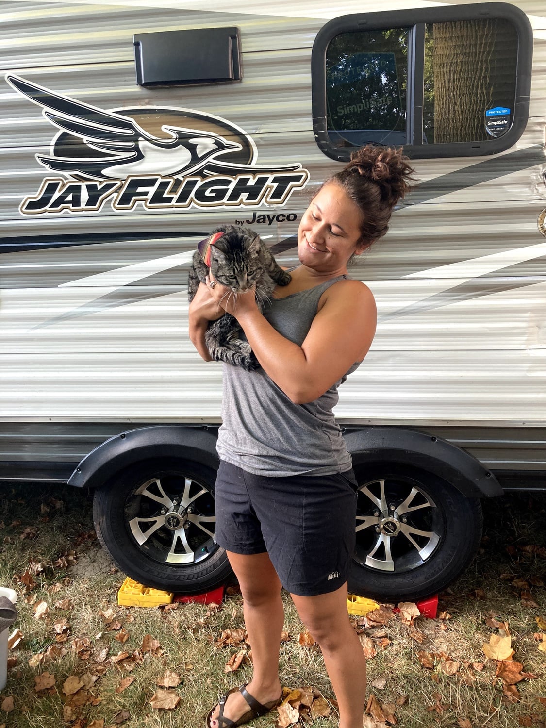 Rebecca and her cat stand out in the Denver backyard where the RV was parked.