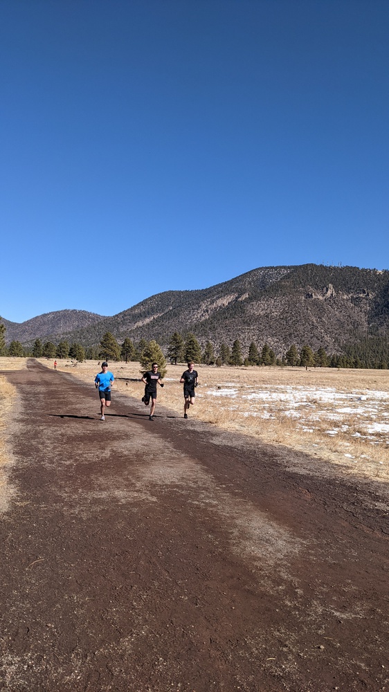 Andrew Avila (left), Luke Laverdiere (middle), and David Melville (right) take advantage of the lower-impact dirt roads and mountain views that Flagstaff, Ariz., have to offer.