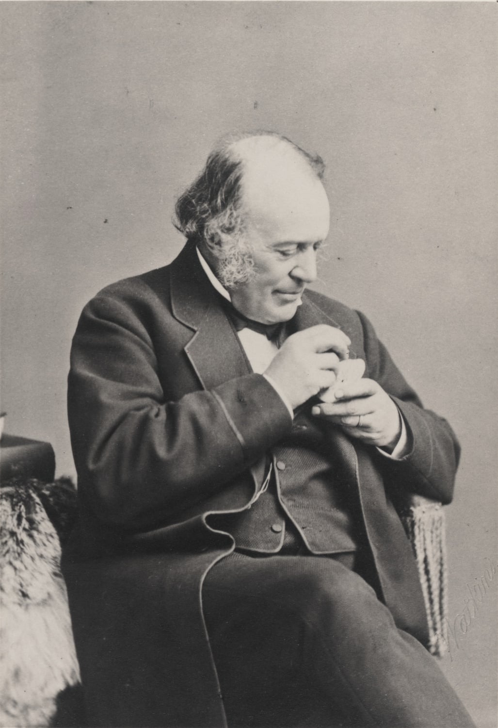 Agassiz examines a sea urchin.