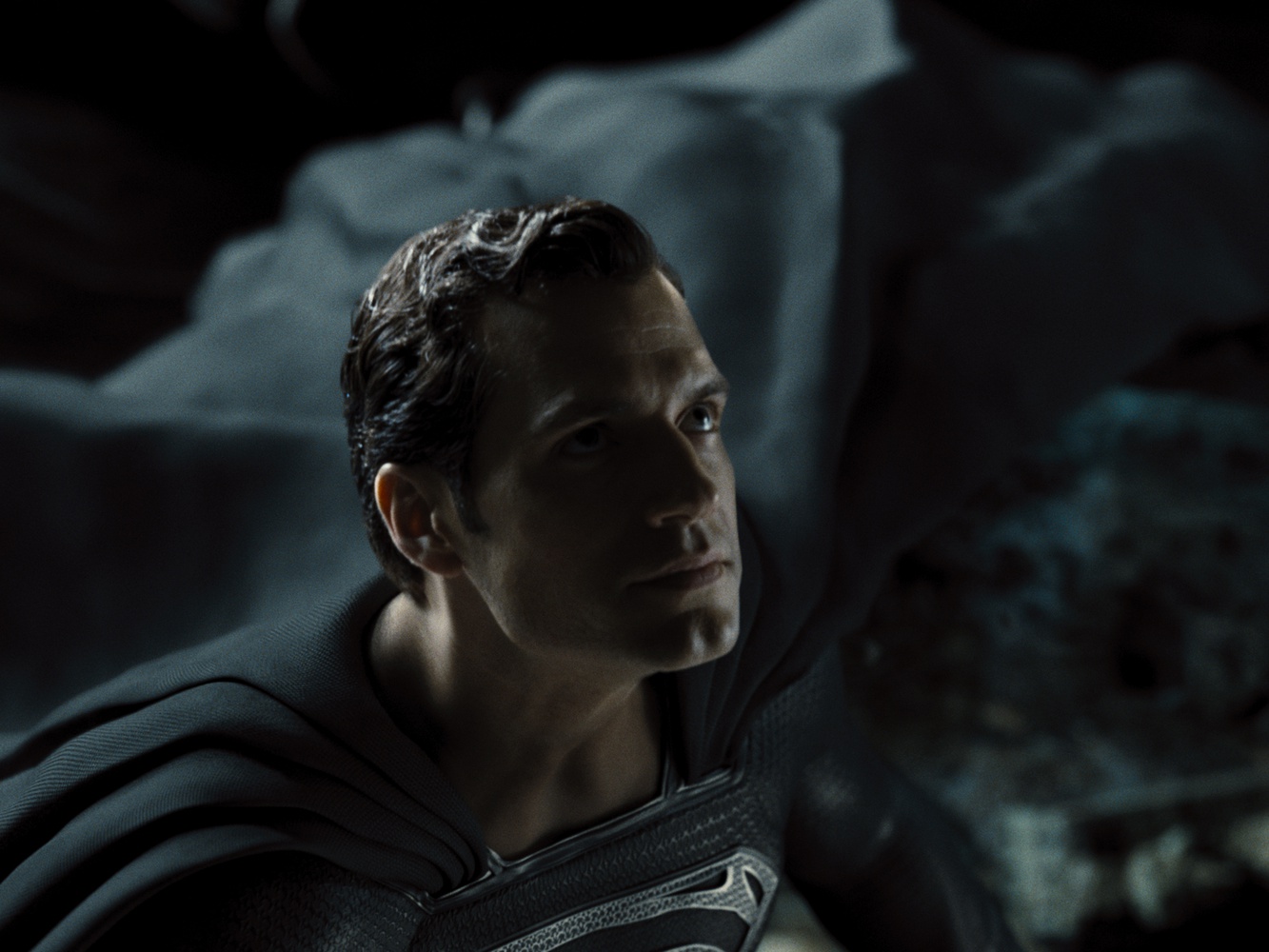 Henry Cavill stars as Clark Kent / Superman, donning a black suit in "Zack Snyder's Justice League" (2021)