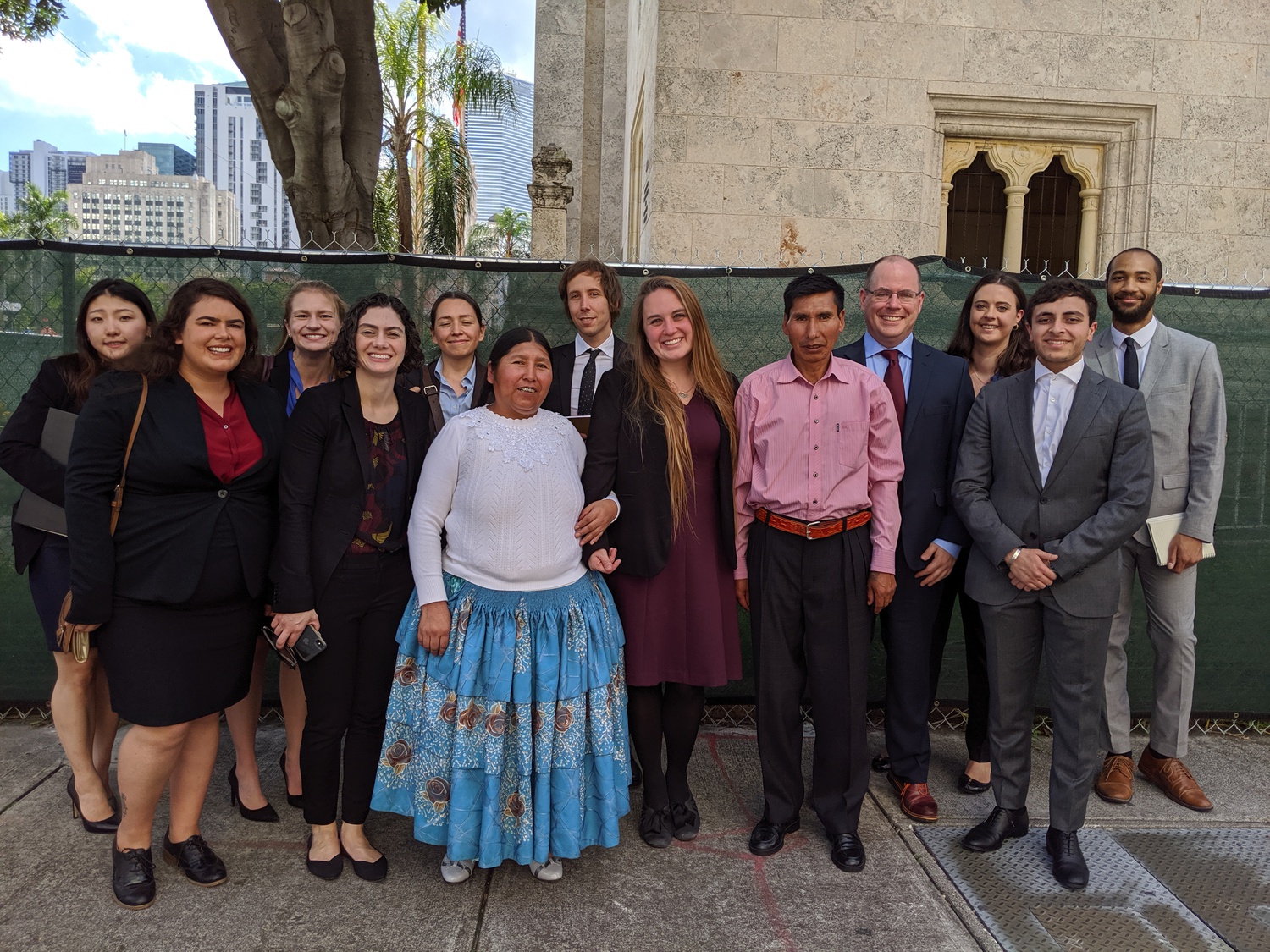 HLS students and instructors from the International Human Rights Clinic, alongside two of the plaintiffs in the case, gather outside the 11th Circuit Court of Appeals following oral argument in November 2019. The Mamanis, whose daughter Marlene was killed in the massacre, traveled to Florida for the hearing.