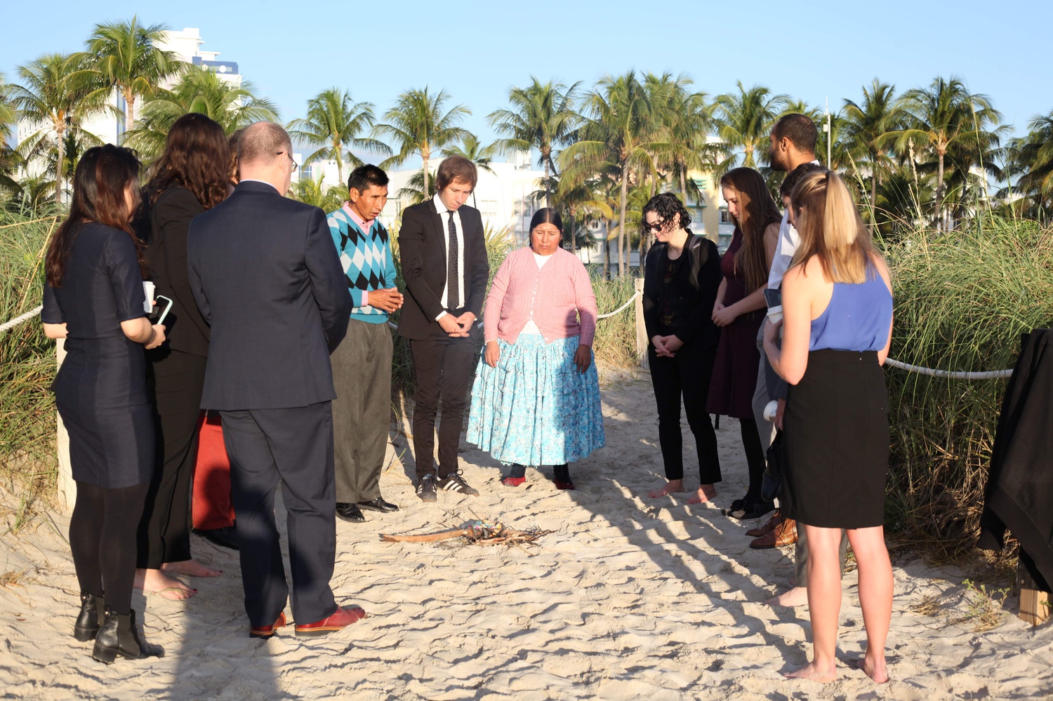 Members of the Harvard team join the Mamanis in an offering to Pachamama, the Andean earth goddess, shortly before oral argument at the 11th Circuit Court of Appeals.