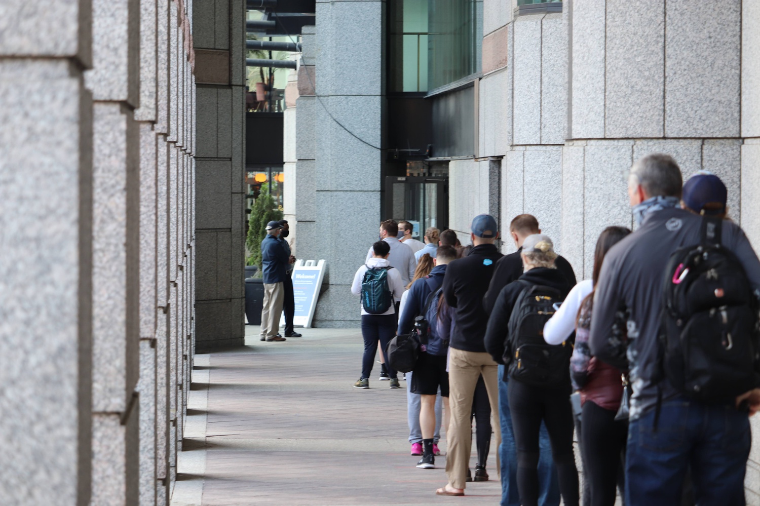 People line up for Covid-19 vaccinations outside Hynes Convention Center in Boston on Tuesday.