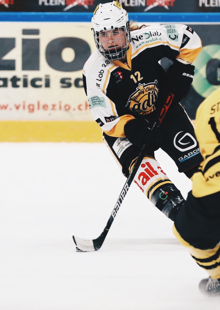 Forward Keely Moy (#12, pictured above) averaged 1-point per game in the 2020-21 campaign for HC Ladies Lugano, a season that ended with Lugano winning the Swiss championship, three games to one, in a best-of-five series. Brother Tyler Moy, also a forward, has played in Switzerland since the 2018-19 season.