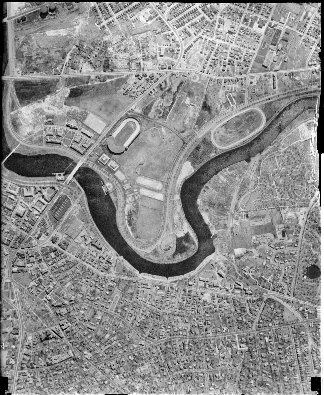 A bird’s-eye view of Allston taken before World War II with Harvard Stadium and the Business School visible. Much of the low-lying Allston area had yet to be developed by Harvard which were open fields or small developments.