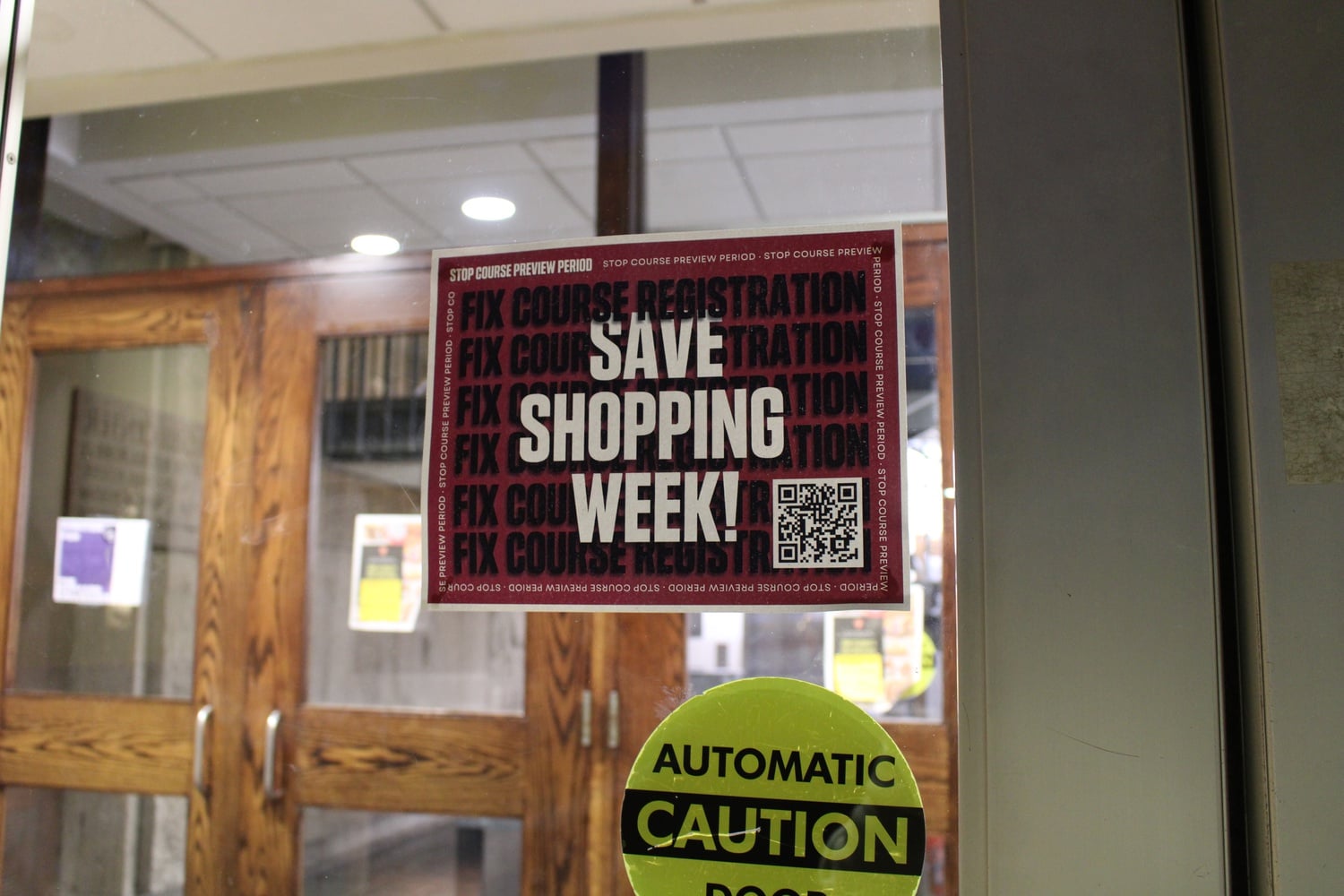 Student activists posted flyers across campus urging their peers to sign onto a petition demanding the College keeps shopping week.