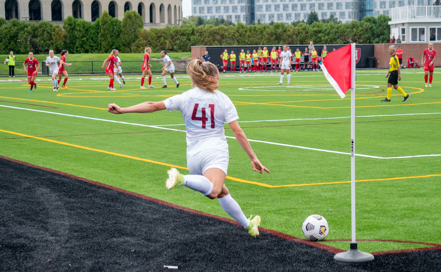 Hannah Bebar takes a corner kick in Sunday's matchup against the Red Storm. Later in the match, she would provide the golden goal that carried the Crimson to a 3-0 record.