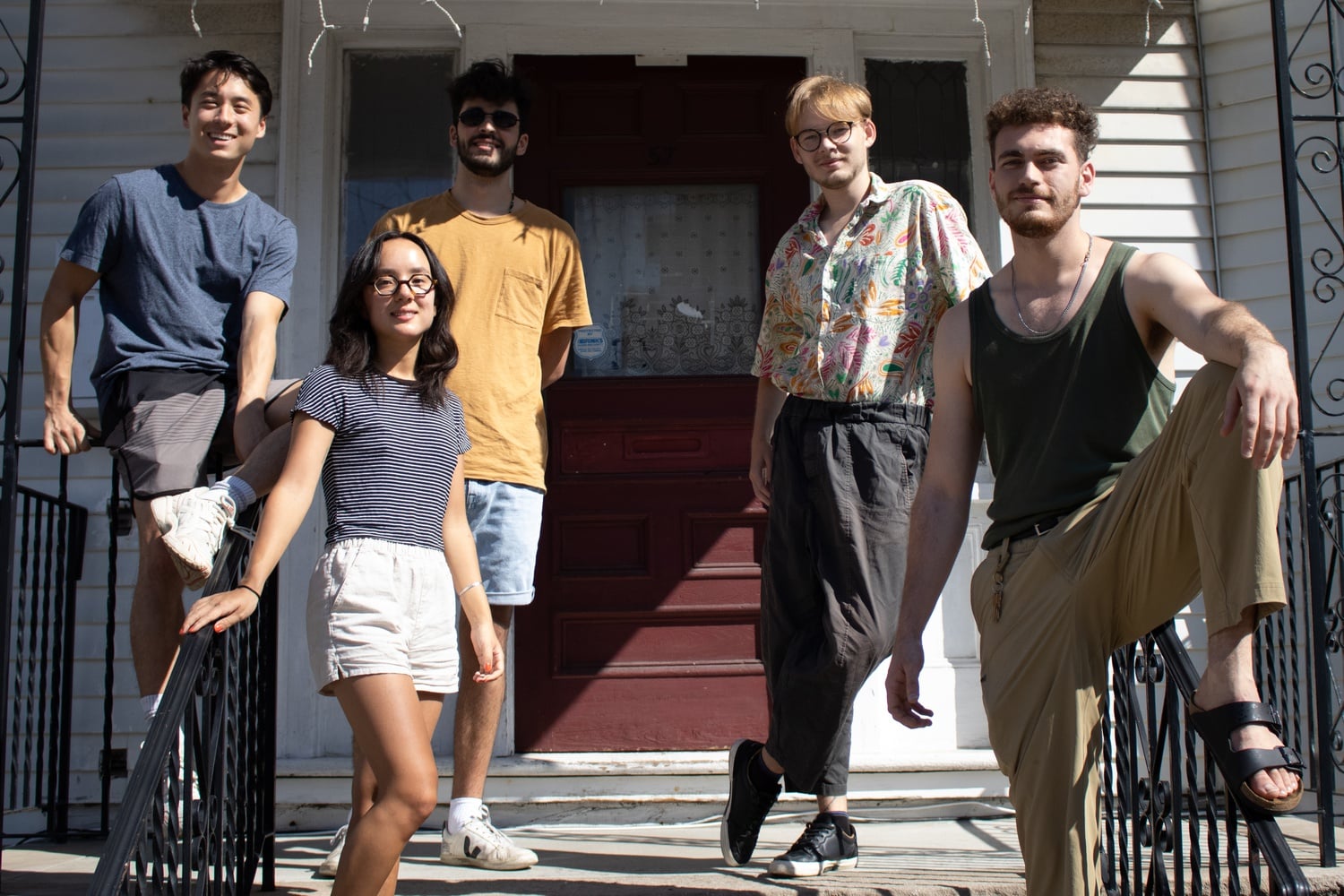 Ethan Whang ‘21-‘22, Carmen Enrique ‘21, Trevor Bishai ‘21-‘22, Herkus Gudavicius ‘21-‘22, and Rheede Erasmus ‘22 pose for a photograph at the entrance to their off-campus housing.
