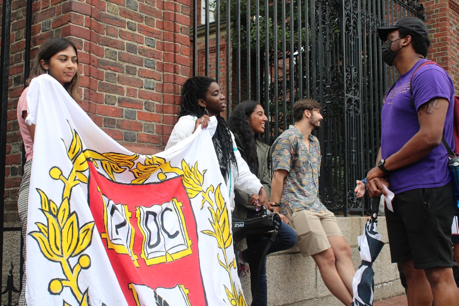 People rally for prison divestment outside Johnston Gate on Thursday afternoon.