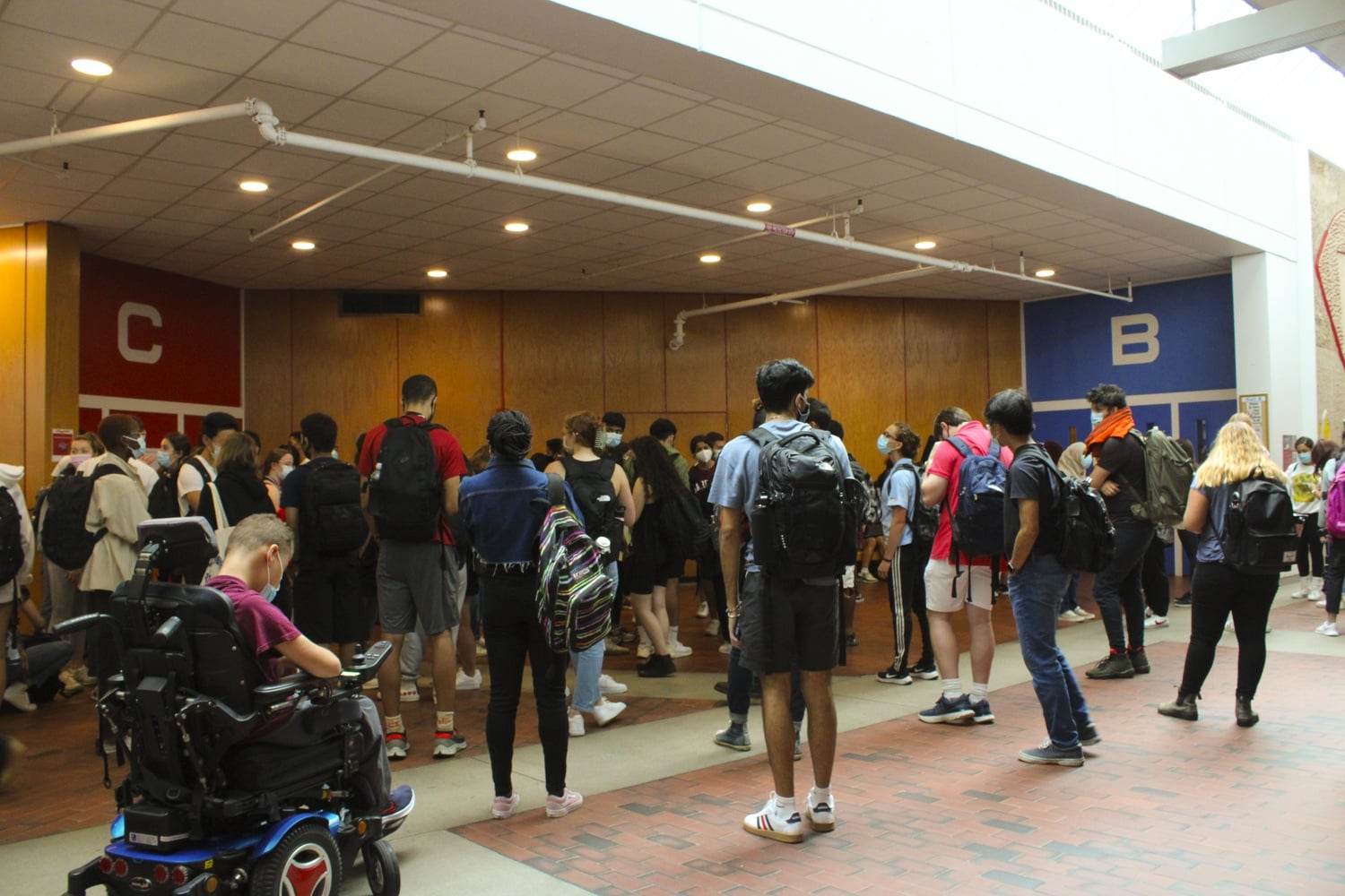 Students wait outside of lecture hall C for Life Sciences 1a in the Science Center.