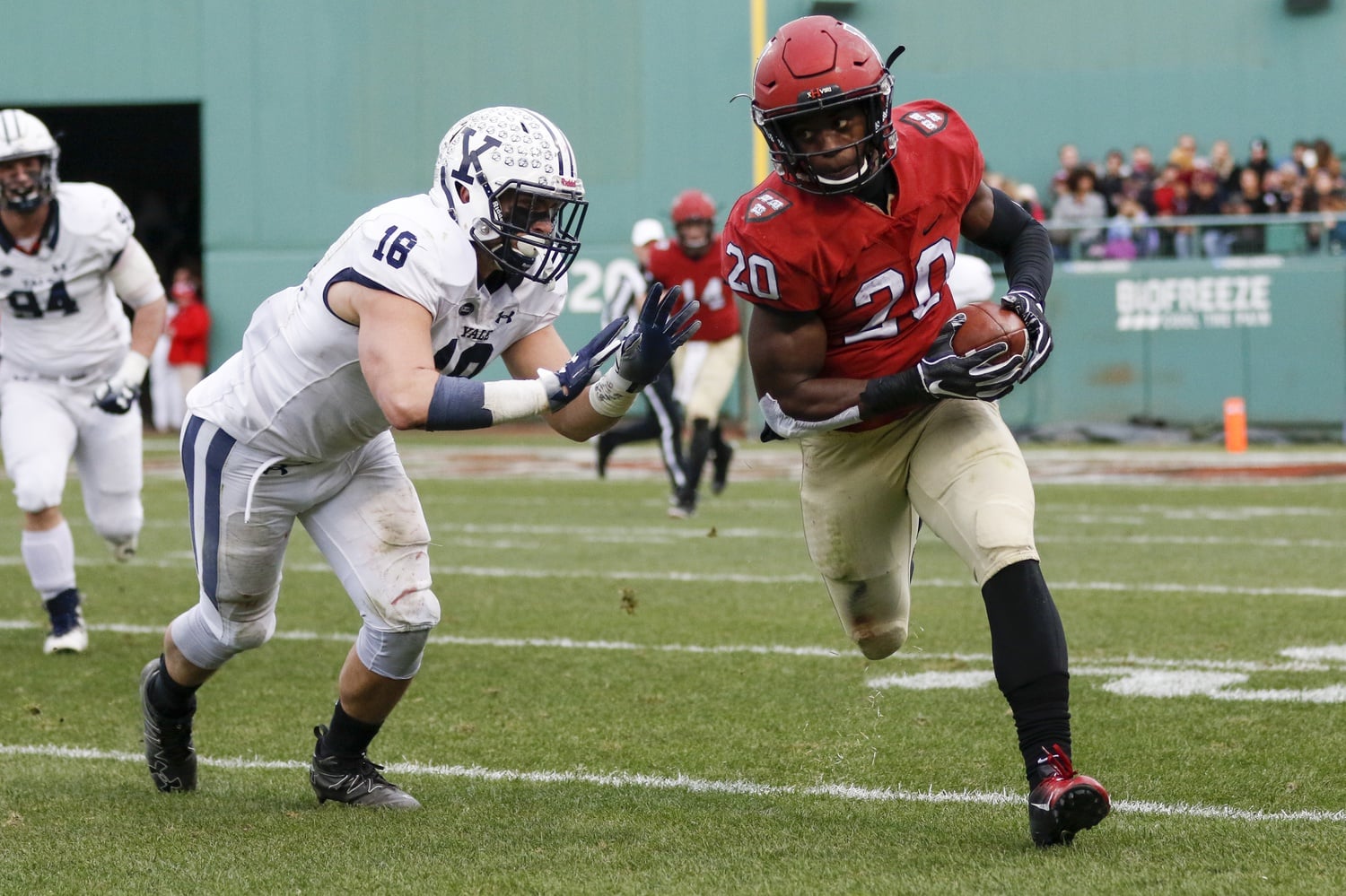 Junior running back Aaron Shampklin, Saturday's leading rusher with 183 yards and two touchdowns, rushes in 2018's Harvard-Yale game at Fenway Park.