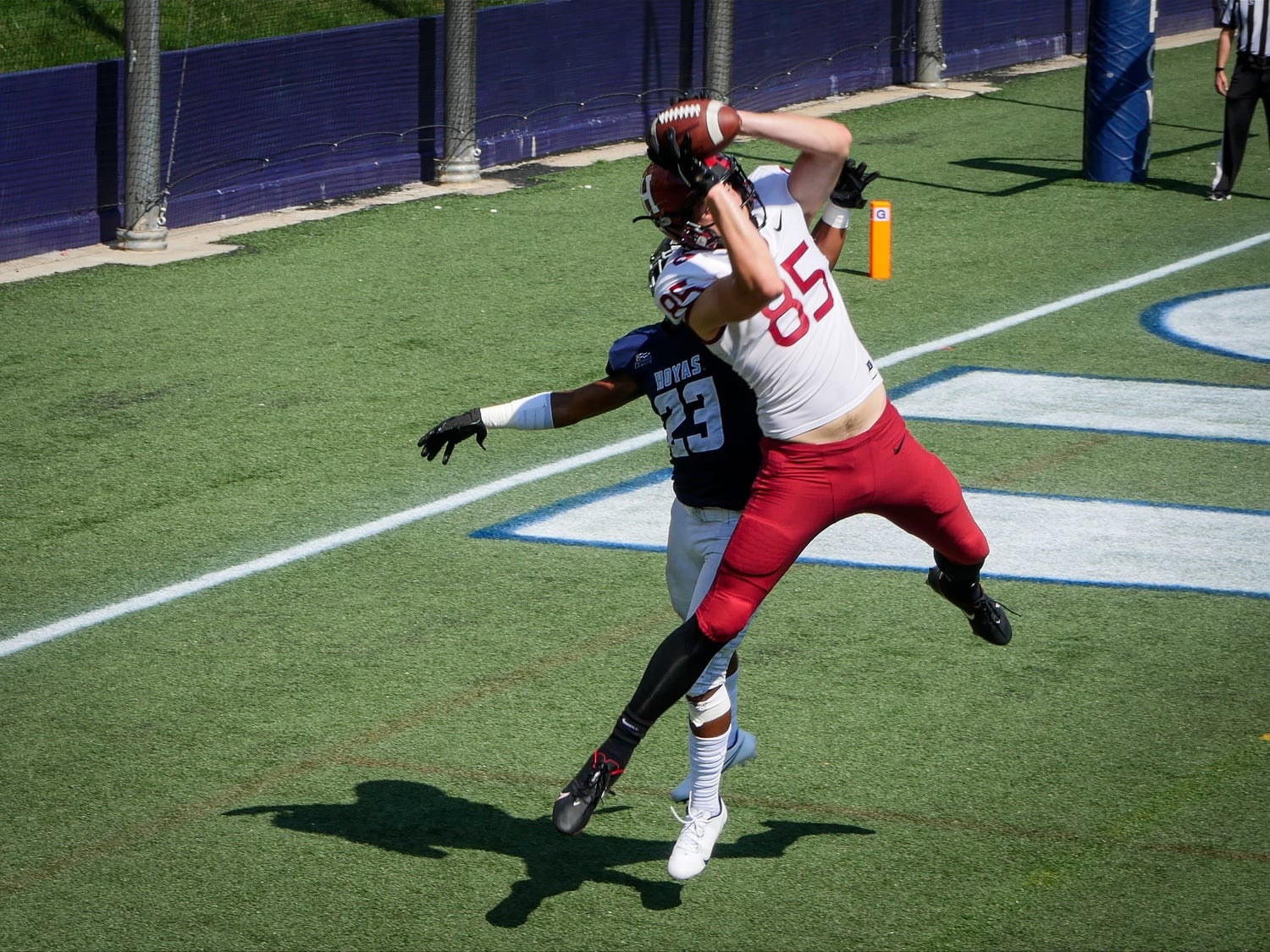 Senior tight end Adam West skies above the Hoyas defender to pull down a touchdown grab, giving the Crimson a 37-9 lead en route to a 44-9 final score.