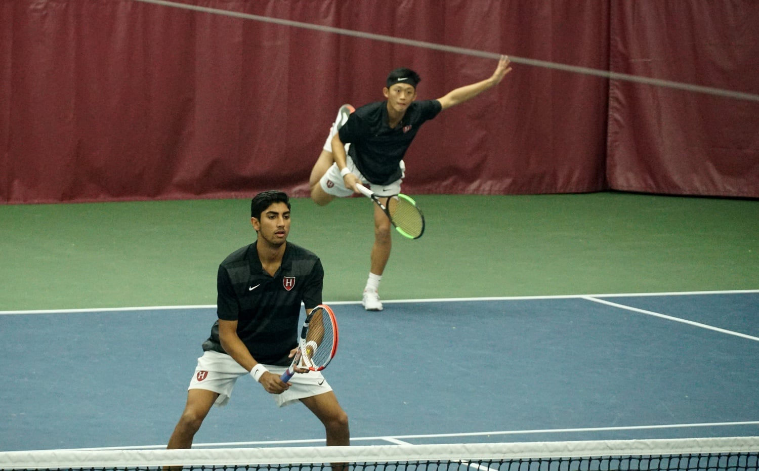 Sophomore Ronan Jachuck (front) and senior Brian Shi helped Harvard men's tennis sweep Rice in February 2020.