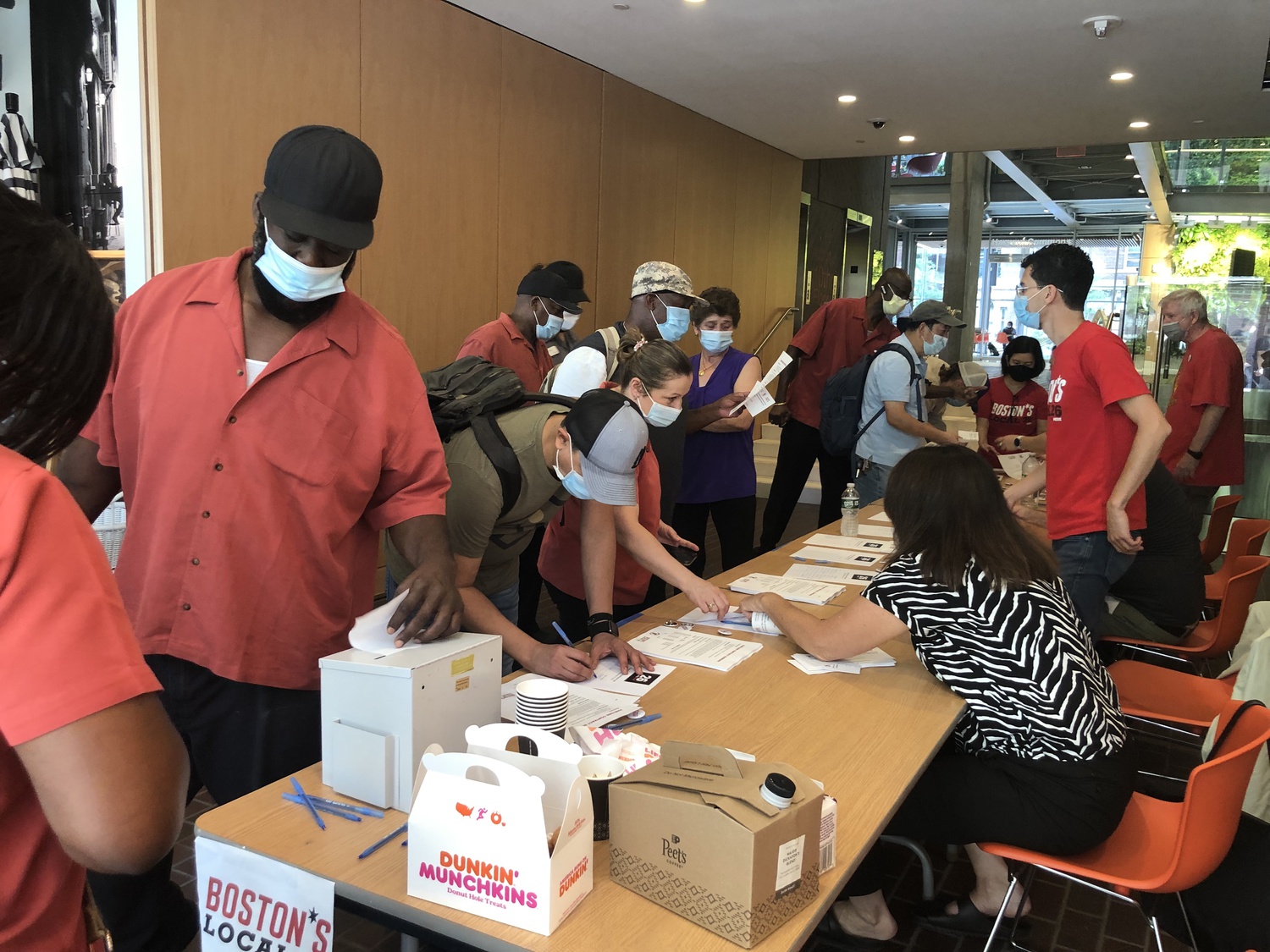 Members of Harvard's dining employees union, UNITE HERE Local 26, vote on whether to ratify the union's tentative agreement with the University Thursday in the Smith Campus Center.