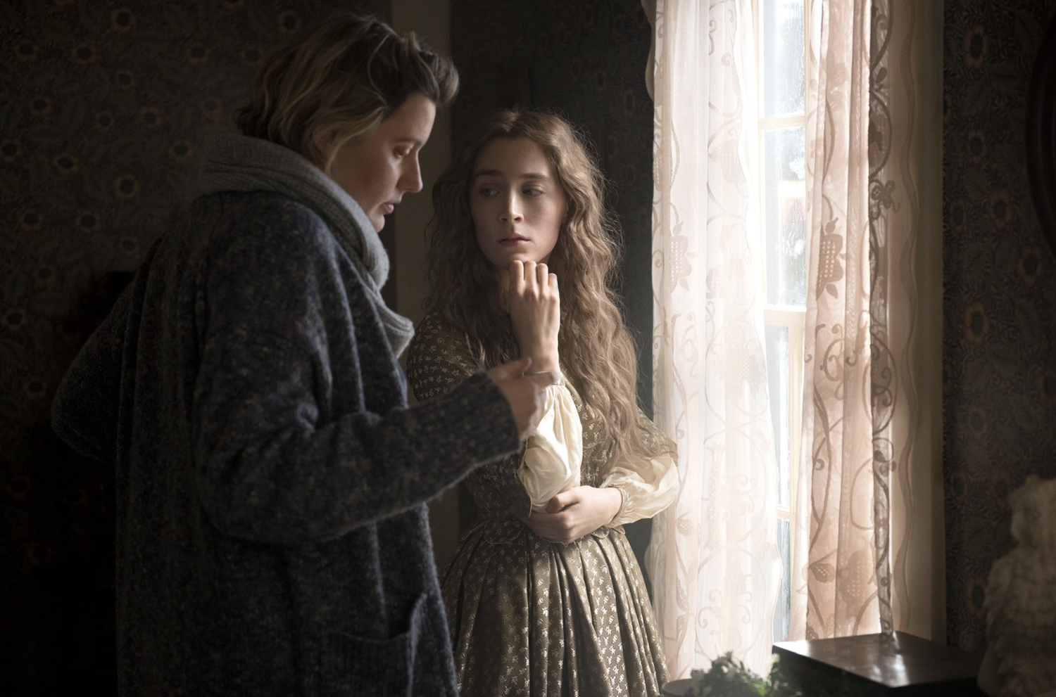 Greta Gerwig (left) directing Saoirse Ronan (right) on the set of "Little Women" (2019).