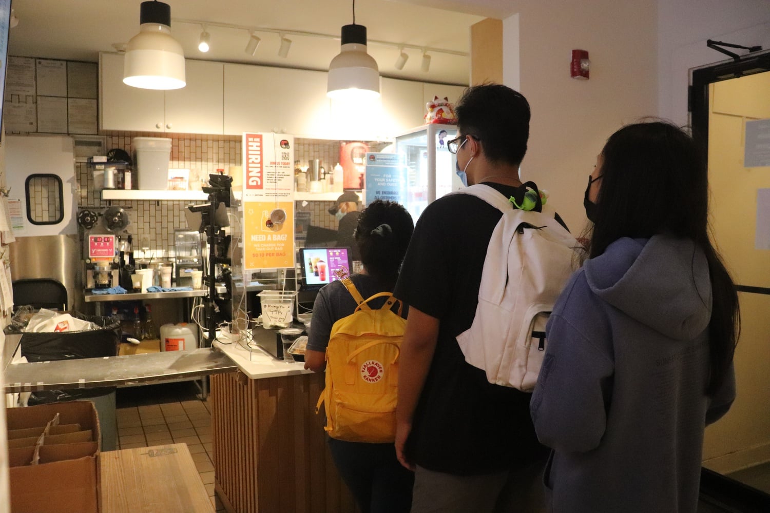Patrons line up inside Kung Fu Tea, a store on Massachusetts Avenue, a frequent sight amid a national shortage in restaurant workers.
