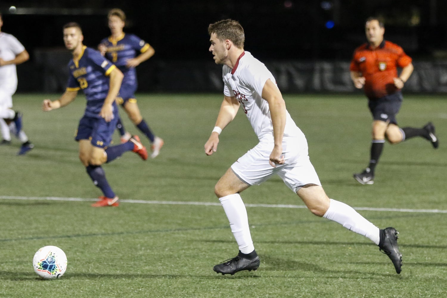 Junior forward Duncan Sutherland, pictured above in 2019, was instrumental in helping set up the Crimson's first goal in its 2-1 OT victory over the Catamounts.