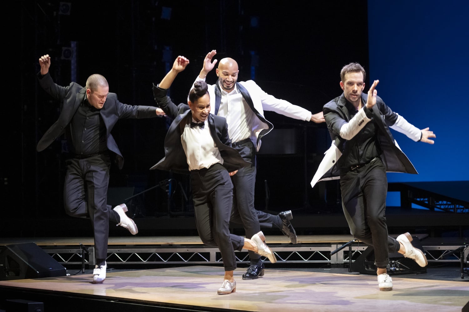 Anthony Morigerato, Ayodele Casel, John Manzari, and Kurt Csolak dance in "Ayodele Casel: Chasing Magic" at the American Repertory Theater.