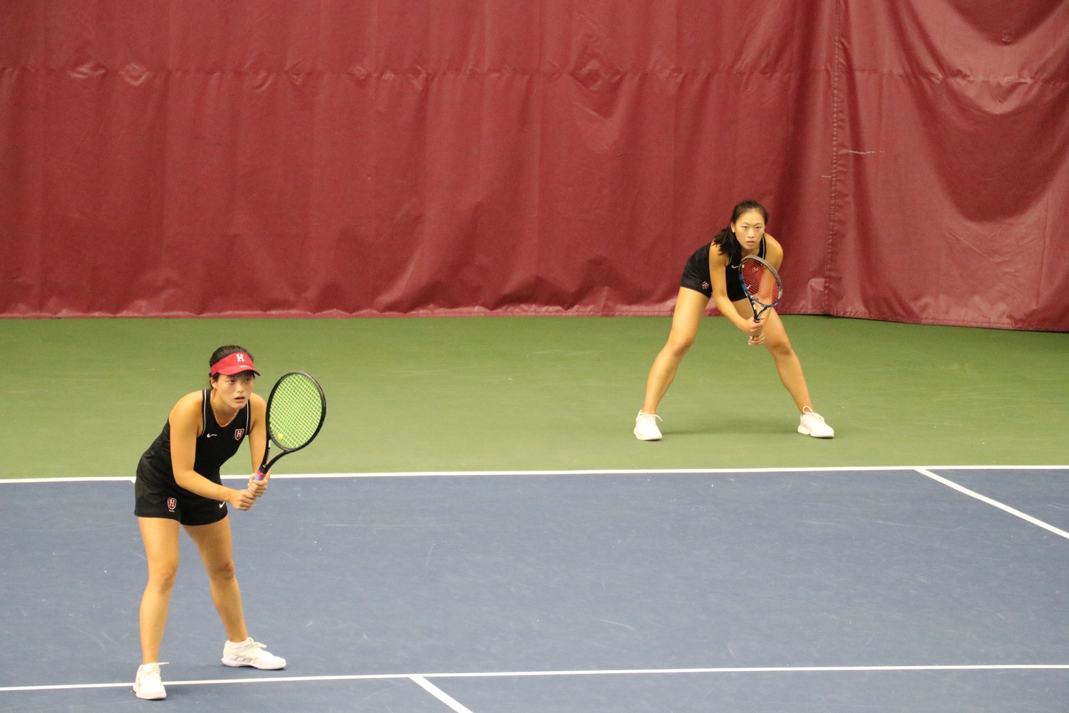 First-year Angel You and senior Rachel Lim team up in doubles against Boston University.