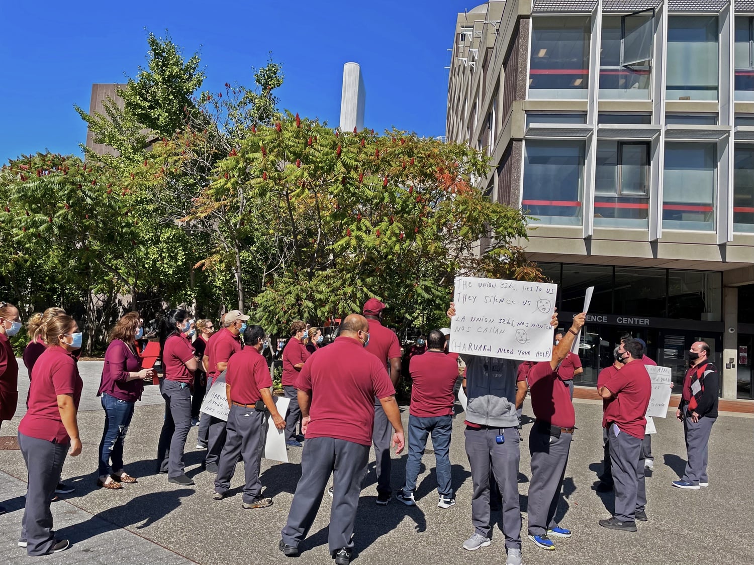 Approximately 25 Harvard custodians rallied in Science Center Plaza Friday, asking the University to postpone the opening of negotiations with their union until intraunion conflicts are resolved.